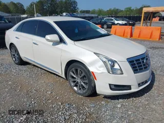 2014 Cadillac XTS with VIN 2G61L5S3XE9231858, listed as a IAAI auction lot 41941564 with 158,479 mi miles. Bid and sale history available at carsss.com. Image 1.