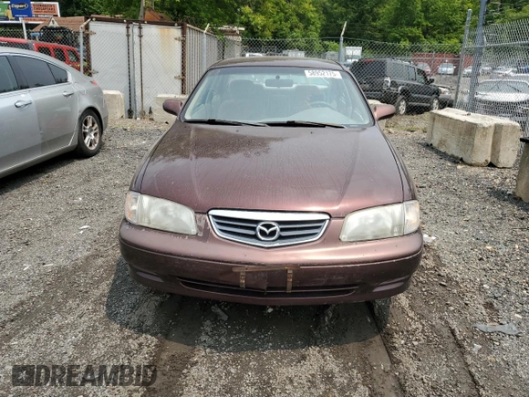 2000 Mazda 626 LX z VIN 1YVGF22C4Y5112874, wystawiony jako Copart lot #58952175 z przebiegiem 100 070 mil mil oraz Szkoda całkowita • Salvage title. Historia ofert i sprzedaży dostępna na DreamBid. Obrazek 5.