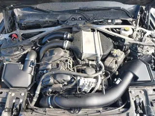 2015 BMW M4 with VIN WBS3R9C57FK334921, listed as a IAAI auction lot 41869773 with 107,058 mi miles. Bid and sale history available at carsss.com. Image 10.