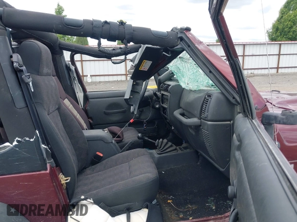 2003 Jeep Wrangler X z VIN 1J4FA39S73P349014, wystawiony jako IAAI lot #42582747 z przebiegiem 50 525 mil mil oraz . Historia ofert i sprzedaży dostępna na DreamBid. Obrazek 5.