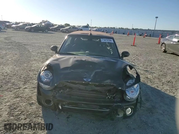 2015 MINI Convertible with VIN WMWZN3C53FT862859, listed as a Copart auction lot 71419764 with 113,356 mi miles and Salvage title. Bid and sale history available at DreamBid. Image 11.