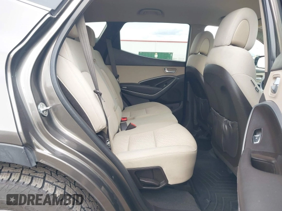 2014 Hyundai Santa Fe z VIN 5XYZTDLB1EG144290, wystawiony jako IAAI lot #42126367 z przebiegiem 138 525 mil mil oraz . Historia ofert i sprzedaży dostępna na DreamBid. Obrazek 8.