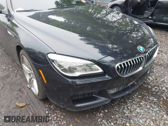 2017 BMW 6 Series 650i xDrive z VIN WBA6F7C52HD930816, wystawiony jako IAAI lot #42168478 z przebiegiem 89 191 mil mil oraz . Historia ofert i sprzedaży dostępna na DreamBid. Obrazek 6.
