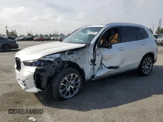 2025 BMW X5 sDrive40i with VIN 5UX13EU06S9X17986, listed as a Copart auction lot 56419935 with 13,128 mi miles and Salvage title. Bid and sale history available at DreamBid. Image 1.