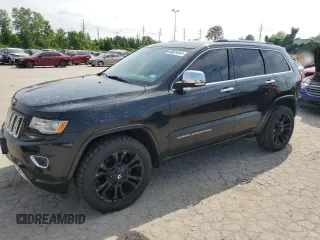 2014 Jeep Grand Cherokee Overland with VIN 1C4RJFCG6EC547604, listed as a Copart auction lot 55824944 with 128,330 mi miles and Clean Title. Bid and sale history available at carsss.com. Image 1.