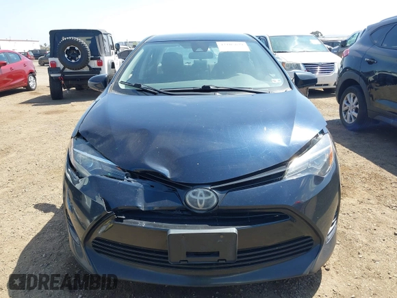 2019 Toyota Corolla L with VIN 2T1BURHE6KC185004, listed as a IAAI auction lot 42105629 with 111,907 mi miles. Bid and sale history available at carsss.com. Image 12.