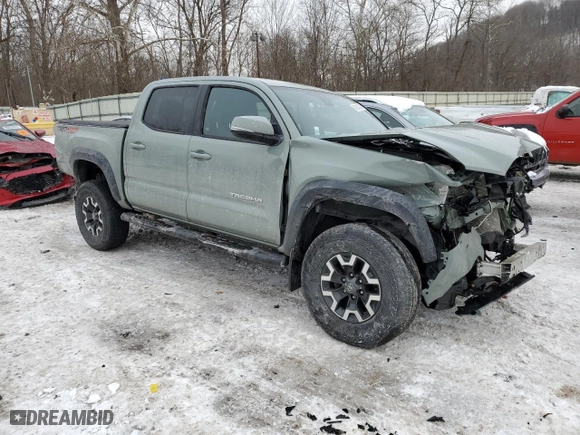 2023 Toyota Tacoma 4WD SR with VIN 3TMCZ5AN5PM574255, listed as a Copart auction lot 87945995 with 33,016 mi miles and Salvage Title. Bid and sale history available at carsss.com. Image 4.