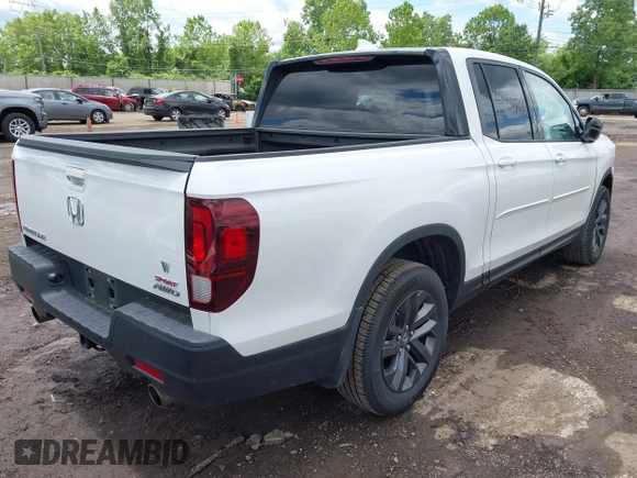 2021 Honda Ridgeline Sport with VIN 5FPYK3F14MB005117, listed as a IAAI auction lot 42343059 with 58,862 mi miles and . Bid and sale history available at DreamBid. Image 4.
