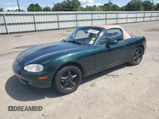 1999 Mazda MX-5 Miata with VIN JM1NB3533X0130160, listed as a Copart auction lot 62560495 with 155,857 mi miles and Salvage title. Bid and sale history available at DreamBid. Image 1.