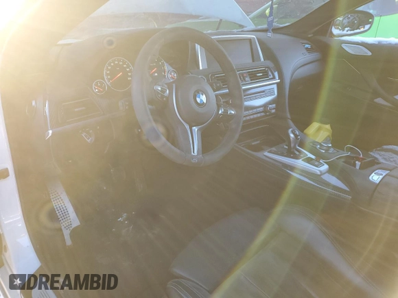 2014 BMW M6 z VIN WBSLX9C51ED160286, wystawiony jako Copart lot #38369134 z przebiegiem Nie podano mil oraz Szkody całkowita. Historia ofert i sprzedaży dostępna na DreamBid. Obrazek 8.
