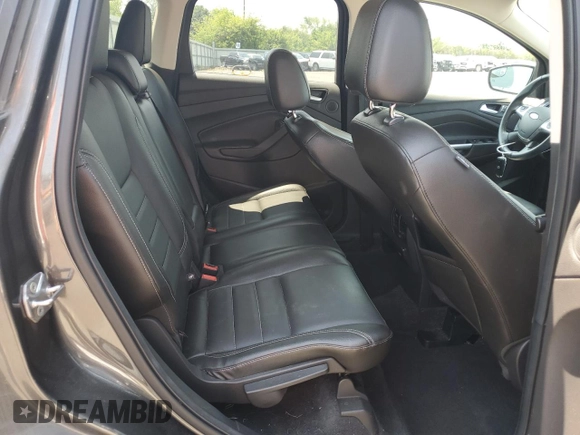 2015 Ford Escape Titanium z VIN 1FMCU9J97FUA38731, wystawiony jako Copart lot #60621085 z przebiegiem 119 704 mil mil oraz Szkoda całkowita • Salvage title. Historia ofert i sprzedaży dostępna na DreamBid. Obrazek 11.