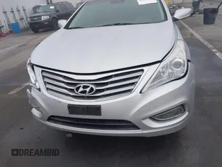 2014 Hyundai Azera Limited with VIN KMHFH4JG7EA388931, listed as a IAAI auction lot 41468407 with 130,597 mi miles and . Bid and sale history available at DreamBid. Image 12.