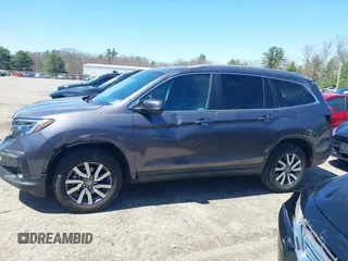2021 Honda Pilot EX-L with VIN 5FNYF6H59MB016354, listed as a IAAI auction lot 42108020 with 61,436 mi miles and . Bid and sale history available at DreamBid. Image 15.