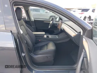 2023 Tesla Model Y Long Range with VIN 7SAYGDEEXPA078629, listed as a IAAI auction lot 42046354 with 27,245 mi miles and . Bid and sale history available at DreamBid. Image 5.