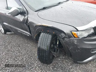 2015 Jeep Grand Cherokee Summit with VIN 1C4RJFJM6FC955904, listed as a IAAI auction lot 41483446 with 65,970 mi miles. Bid and sale history available at carsss.com. Image 6.