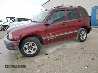 2002 Chevrolet Tracker z VIN 2CNBE13C926911438, wystawiony jako Copart lot #54333975 z przebiegiem 90 797 mil mil oraz Szkoda całkowita • Salvage title. Historia ofert i sprzedaży dostępna na DreamBid. Obrazek 1.