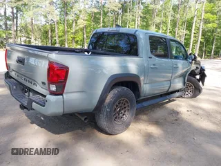 2022 Toyota Tacoma SR z VIN 3TMCZ5AN5NM518961, wystawiony jako IAAI lot #42148345 z przebiegiem 43 009 mil mil oraz . Historia ofert i sprzedaży dostępna na DreamBid. Obrazek 4.