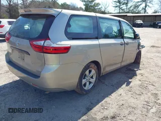 2015 Toyota Sienna L with VIN 5TDZK3DC4FS669496, listed as a IAAI auction lot 41691430 with 119,427 mi miles. Bid and sale history available at carsss.com. Image 4.