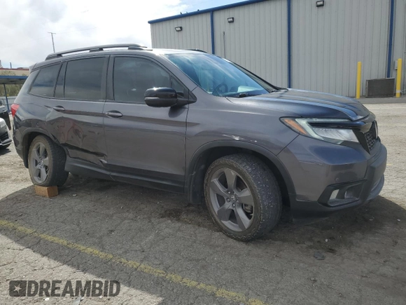 2020 Honda Passport Touring z VIN 5FNYF8H9XLB007336, wystawiony jako Copart lot #51012975 z przebiegiem 74 620 mil mil oraz Szkoda całkowita • Salvage title. Historia ofert i sprzedaży dostępna na DreamBid. Obrazek 4.