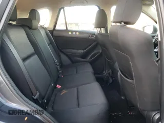 2016 Mazda CX-5 Sport with VIN JM3KE2BY9G0771969, listed as a Copart auction lot 80966064 with 99,348 mi miles and Salvage title. Bid and sale history available at DreamBid. Image 12.