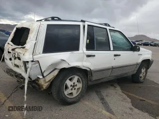 1995 Jeep Grand Cherokee Laredo with VIN 1J4GZ58Y6SC718918, listed as a Copart auction lot 72226394 with 212,670 mi miles and Salvage Title. Bid and sale history available at carsss.com. Image 3.