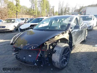 2019 Tesla Model 3 Mid Range with VIN 5YJ3E1EA4KF317872, listed as a IAAI auction lot 41491269 with 90,772 mi miles. Bid and sale history available at carsss.com. Image 18.