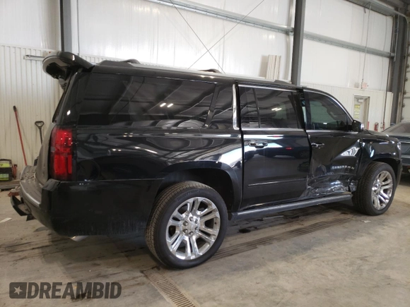 2019 Chevrolet Suburban Premier with VIN 1GNSKJKJ8KR302849, listed as a Copart auction lot 87717275 with 69,498 mi miles and Salvage Title. Bid and sale history available at DreamBid. Image 3.