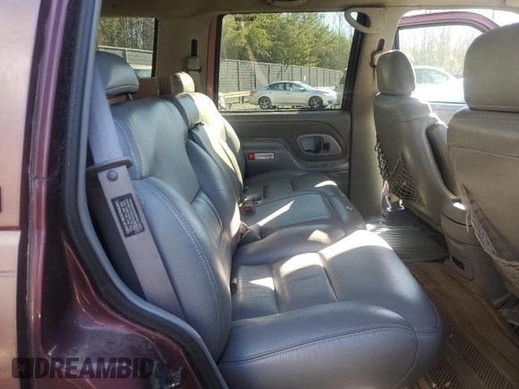 1997 GMC Yukon with VIN 1GKEK13R1VJ702558, listed as a Copart auction lot 85930054 with 165,837 mi miles and Salvage Title. Bid and sale history available at carsss.com. Image 11.