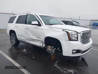 2018 GMC Yukon Denali with VIN 1GKS2CKJ8JR274087, listed as a IAAI auction lot 41097872 with 76,828 mi miles. Bid and sale history available at carsss.com. Image 1.