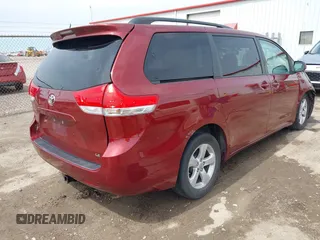 2014 Toyota Sienna LE AAS with VIN 5TDKK3DC4ES462090, listed as a IAAI auction lot 41942354 with 215,814 mi miles. Bid and sale history available at carsss.com. Image 4.