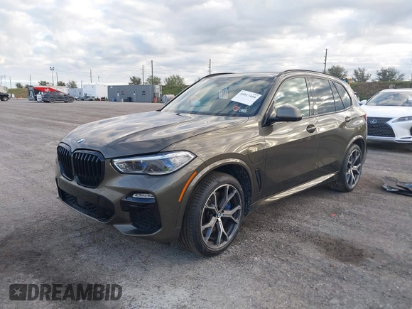 2021 BMW X5 xDrive45e with VIN 5UXTA6C01M9H19575, listed as a IAAI auction lot 40817408 with 37,724 mi miles. Bid and sale history available at carsss.com. Image 2.