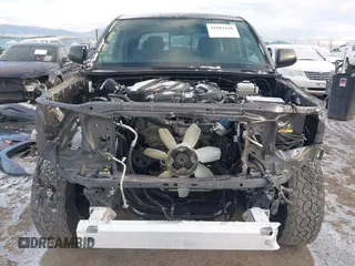 2015 Toyota Tacoma z VIN 3TMLU4EN8FM177785, wystawiony jako IAAI lot #41082160 z przebiegiem 156 761 mil mil oraz . Historia ofert i sprzedaży dostępna na DreamBid. Obrazek 13.