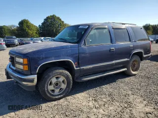 1999 GMC Yukon with VIN 1GKEK13R3XJ757466, listed as a Copart auction lot 75750884 with 270,768 mi miles and Salvage Title. Bid and sale history available at carsss.com. Image 1.