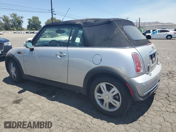 2006 MINI Convertible with VIN WMWRF33576TG16056, listed as a Copart auction lot 63127705 with 108,654 mi miles and Salvage title. Bid and sale history available at DreamBid. Image 2.