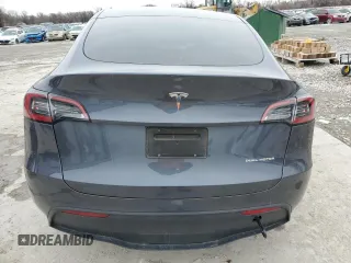 2023 Tesla Model Y Long Range z VIN 7SAYGDEE8PF884567, wystawiony jako Copart lot #45181465 z przebiegiem 16 653 mil mil oraz Szkoda całkowita • Salvage title. Historia ofert i sprzedaży dostępna na DreamBid. Obrazek 6.