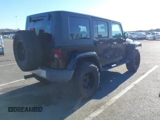 2010 Jeep Wrangler Unlimited Sahara with VIN 1J4HA5H16AL215659, listed as a IAAI auction lot 41749218 with 55,544 mi miles. Bid and sale history available at carsss.com. Image 4.