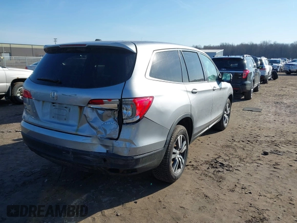 2017 Honda Pilot EX-L with VIN 5FNYF6H50HB059096, listed as a IAAI auction lot 41757214 with 165,651 mi miles and . Bid and sale history available at DreamBid. Image 4.