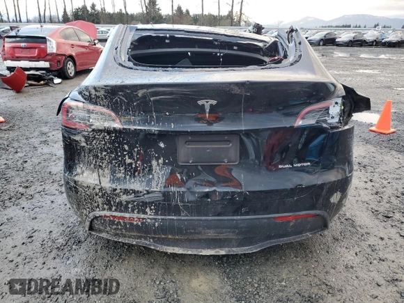 2023 Tesla Model Y Long Range with VIN 7SAYGAEE0PF832185, listed as a Copart auction lot 85159764 with Not Provided miles and Salvage Title. Bid and sale history available at DreamBid. Image 6.