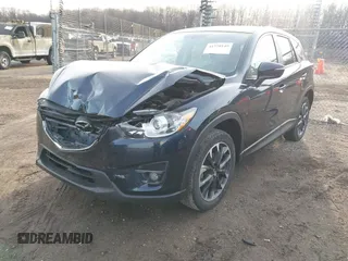 2016 Mazda CX-5 Grand Touring with VIN JM3KE4DY1G0823989, listed as a IAAI auction lot 41770149 with 40,677 mi miles. Bid and sale history available at carsss.com. Image 2.