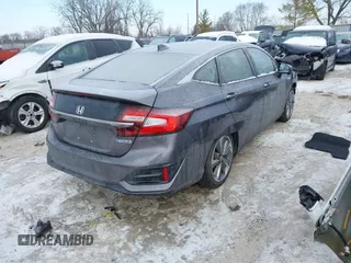2018 Honda Clarity z VIN JHMZC5F13JC006627, wystawiony jako IAAI lot #41335364 z przebiegiem 58 662 mil mil oraz . Historia ofert i sprzedaży dostępna na DreamBid. Obrazek 4.