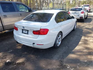 2014 BMW 3 Series 328i xDrive with VIN WBA3B3C55EJ979836, listed as a IAAI auction lot 41886624 with 140,684 mi miles. Bid and sale history available at carsss.com. Image 4.