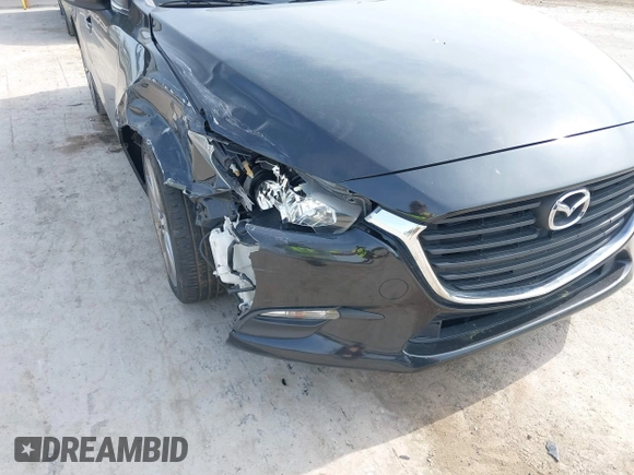 2017 Mazda 3 Touring z VIN 3MZBN1V74HM133565, wystawiony jako IAAI lot #42160836 z przebiegiem 104 997 mil mil oraz . Historia ofert i sprzedaży dostępna na DreamBid. Obrazek 6.