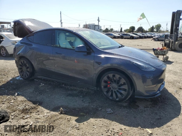 2023 Tesla Model Y Performance with VIN 7SAYGDEF0PF915030, listed as a Copart auction lot 50159375 with 19,772 mi miles and Salvage Title. Bid and sale history available at DreamBid. Image 4.