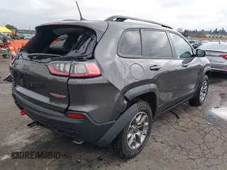 2022 Jeep Cherokee Trailhawk with VIN 1C4PJMBX6ND505196, listed as a IAAI auction lot 41536316 with 9,976 mi miles. Bid and sale history available at carsss.com. Image 4.