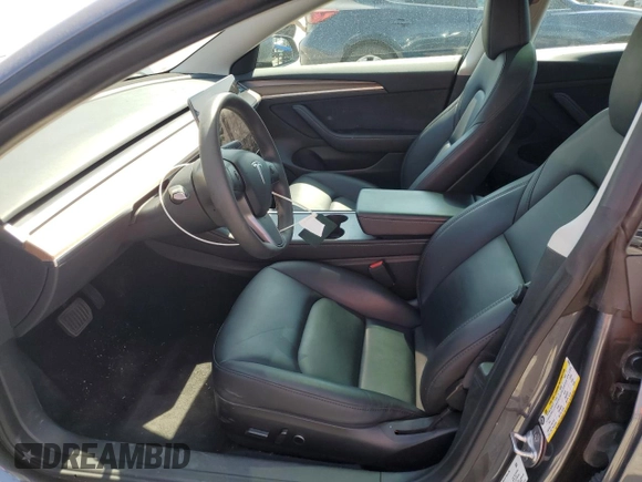 2023 Tesla Model 3 with VIN 5YJ3E1EA3PF695267, listed as a Copart auction lot 52559645 with 9,025 mi miles and Salvage title. Bid and sale history available at DreamBid. Image 7.