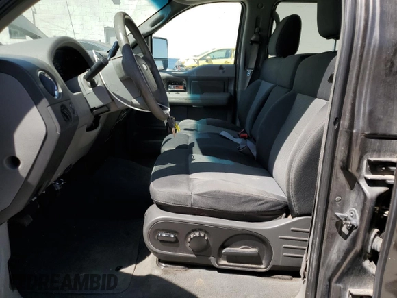 2007 Ford F-150 XLT with VIN 1FTPW14V87KC81567, listed as a Copart auction lot 61583215 with 196,855 mi miles and Salvage title. Bid and sale history available at DreamBid. Image 7.