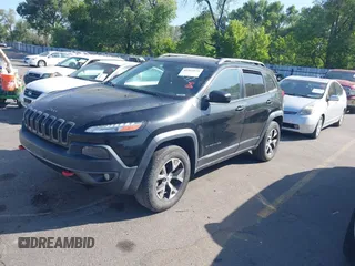 2015 Jeep Cherokee Trailhawk with VIN 1C4PJMBS4FW556822, listed as a IAAI auction lot 42412874 with 129,865 mi miles and . Bid and sale history available at DreamBid. Image 17.
