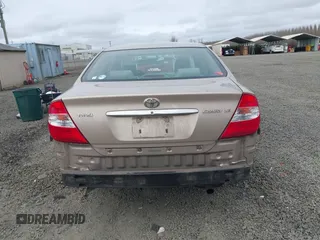 2002 Toyota Camry LE z VIN 4T1BE32K72U028489, wystawiony jako IAAI lot #41760604 z przebiegiem 163 950 mil mil oraz . Historia ofert i sprzedaży dostępna na DreamBid. Obrazek 17.