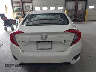 2016 Honda Civic Sedan LX with VIN 19XFC2F59GE028056, listed as a IAAI auction lot 41875940 with 124,243 mi miles. Bid and sale history available at carsss.com. Image 16.