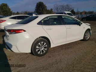 2021 Toyota Corolla Hybrid LE with VIN JTDEAMDE5MJ011169, listed as a Copart auction lot 88752265 with 52,994 mi miles and Salvage Title. Bid and sale history available at carsss.com. Image 3.